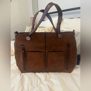 Faux leather handbag, lightweight.  Can be used as cosmetic bag as well.